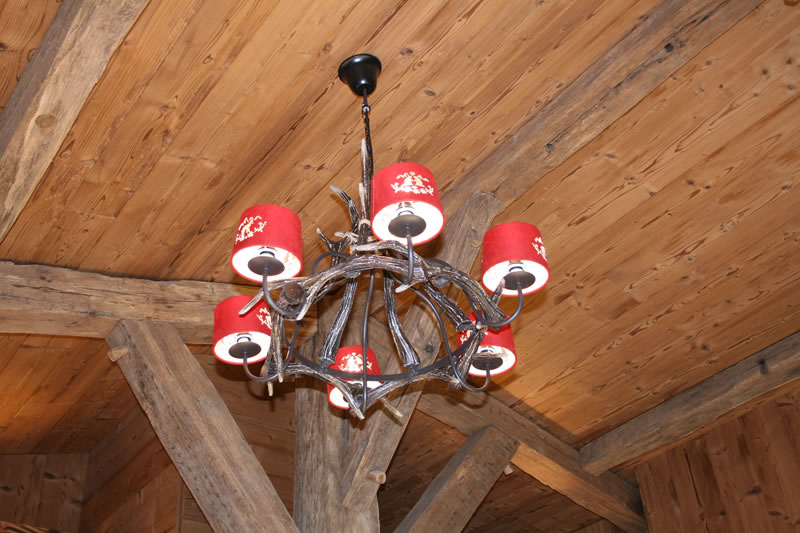 The wooden chandelier and the chalet’s woodwork